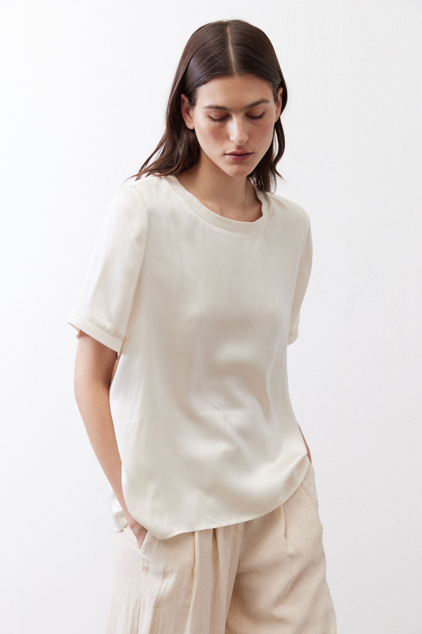Ivory relaxed silk top with crew neck and short sleeves, front detail