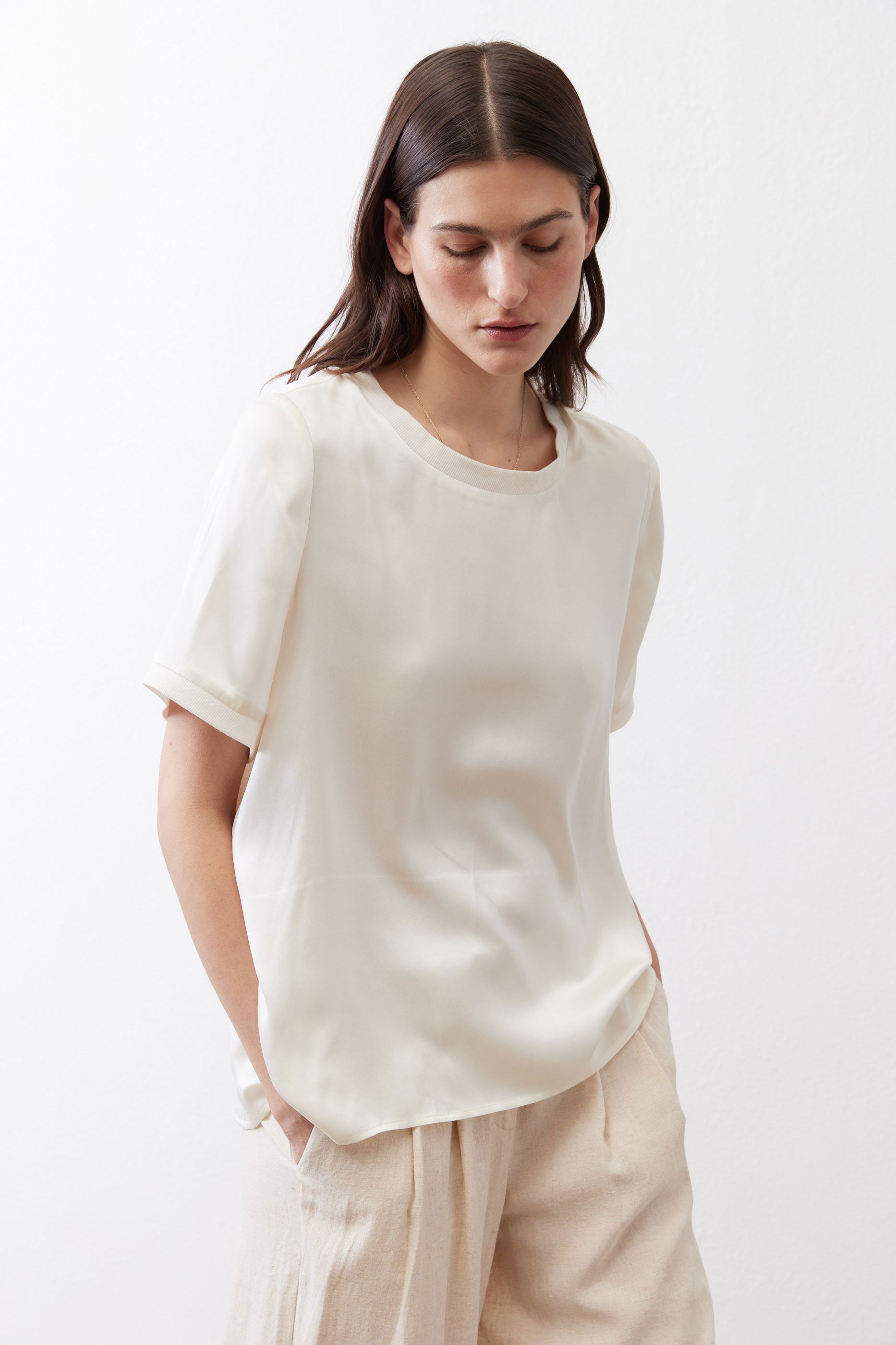 Ivory relaxed silk top with crew neck and short sleeves, front detail