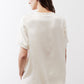 Ivory silk top back view with short sleeves and rounded crew neckline