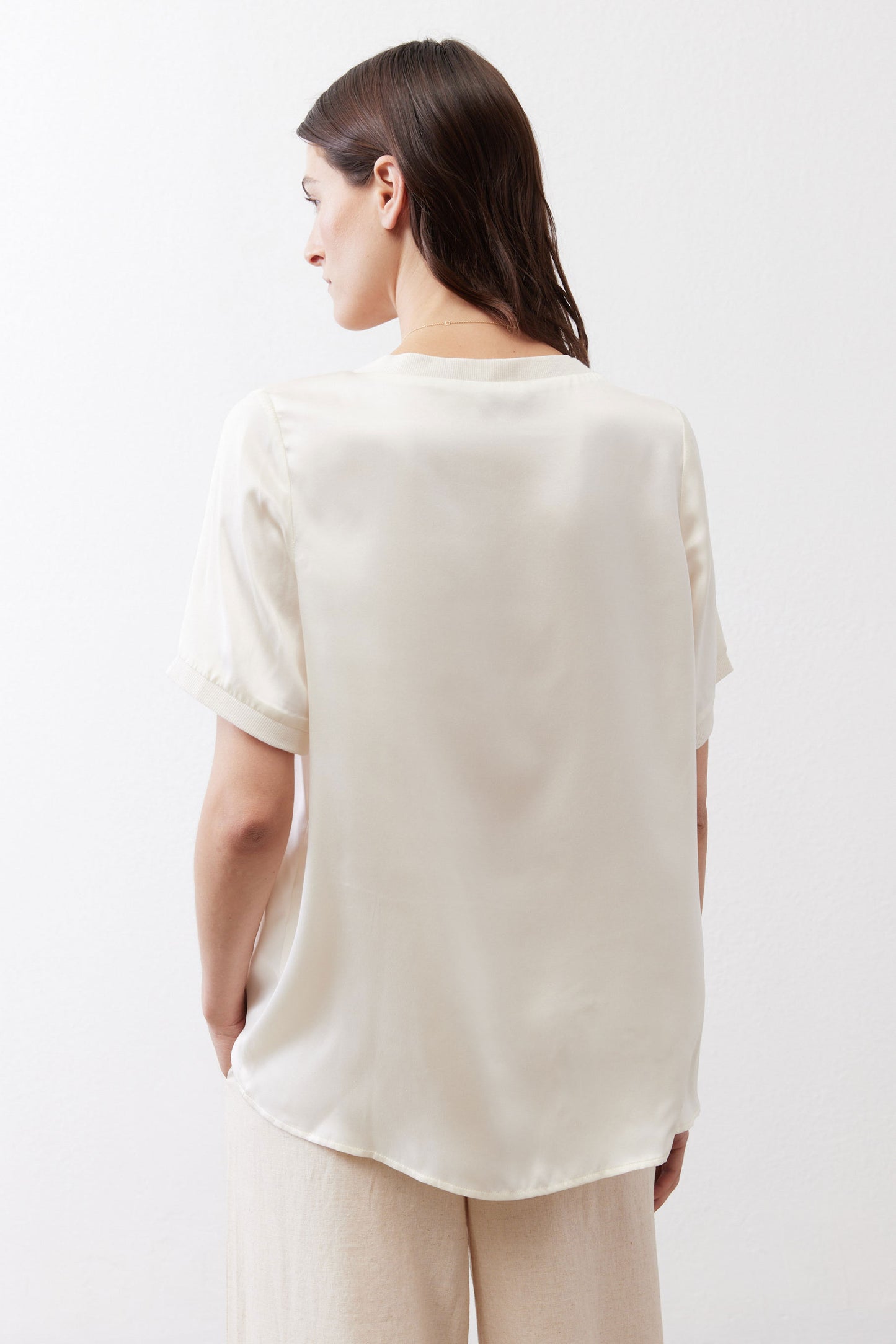 Ivory silk top back view with short sleeves and rounded crew neckline