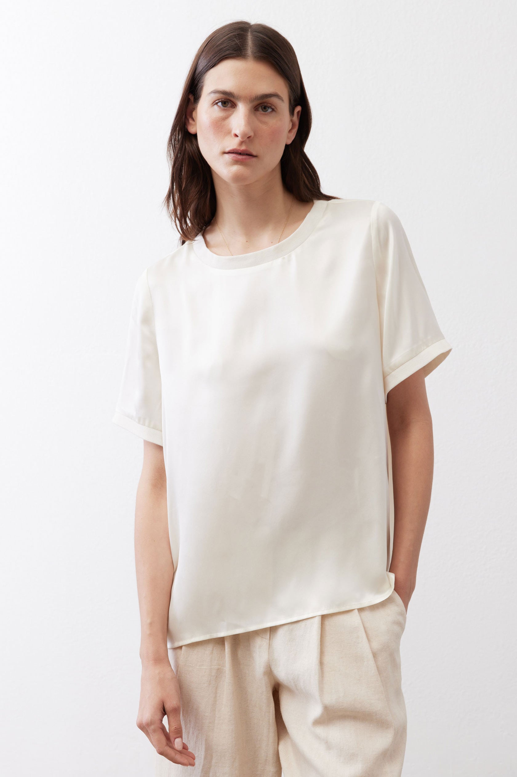 Ivory relaxed silk top front view with crew neck and short sleeves