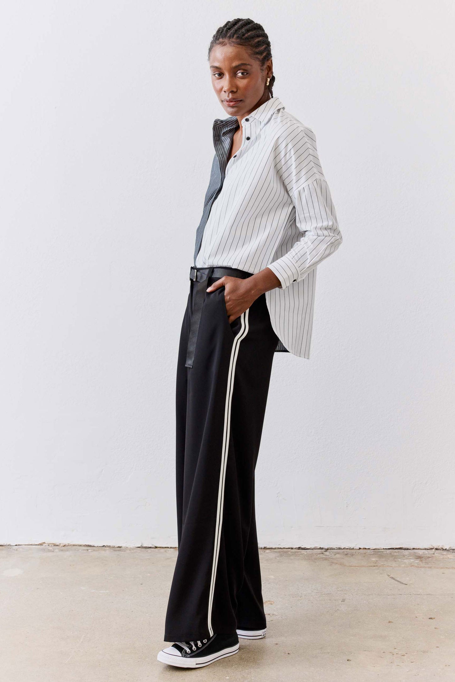 Striped button-down blouse with vertical light gray and white stripes, long sleeves
