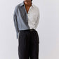 Striped button-down blouse with vertical light gray and white stripes, open collar