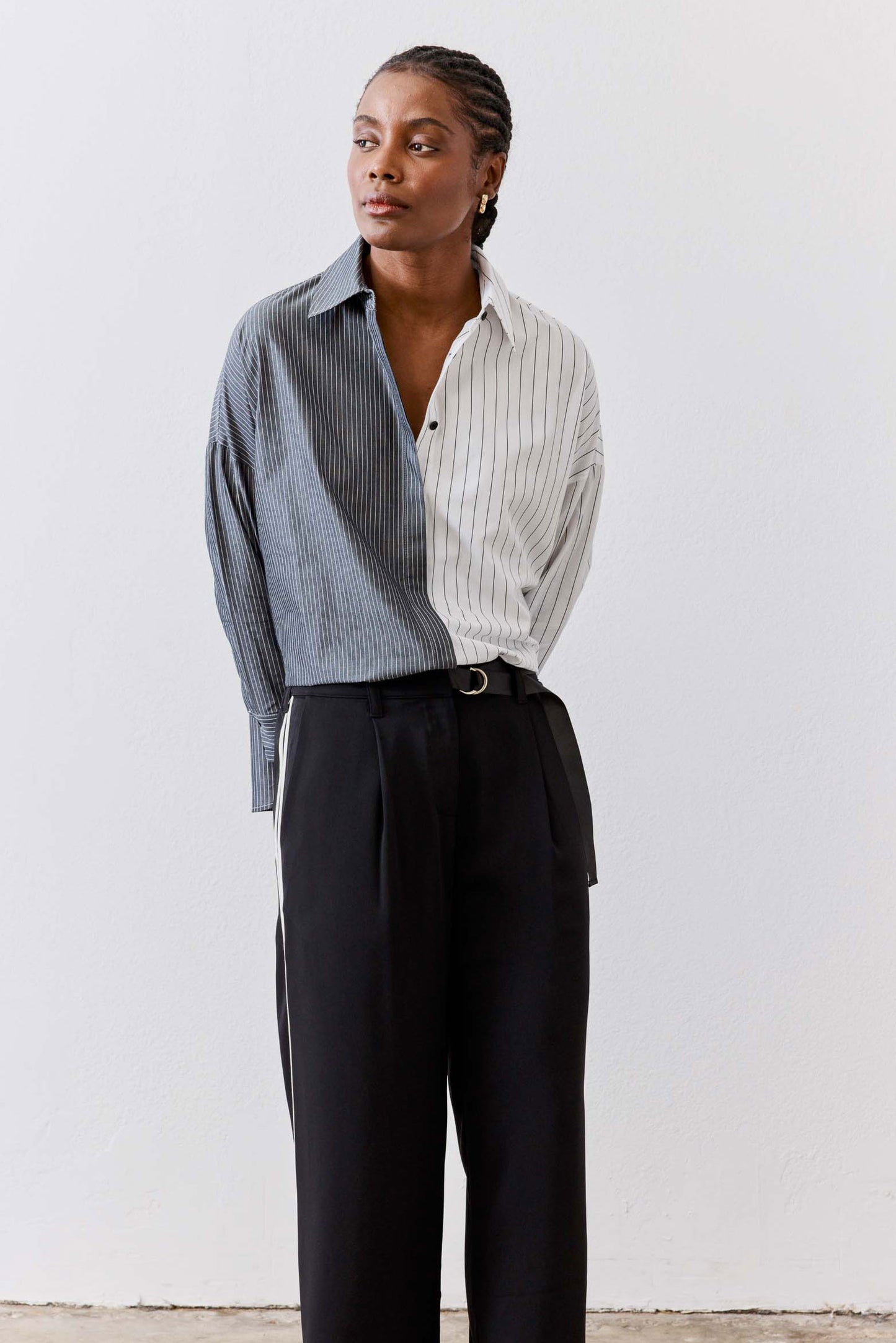 Striped button-down blouse with vertical light gray and white stripes, open collar