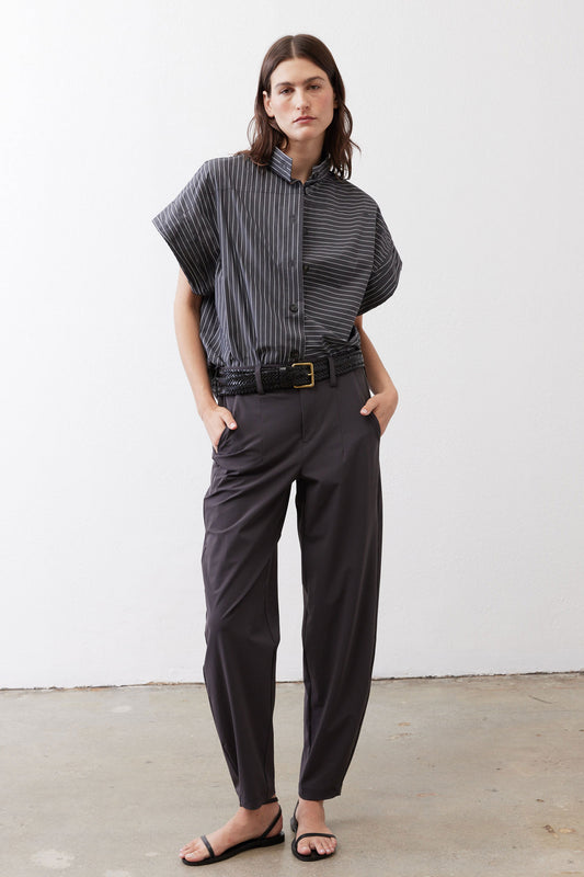 Gray striped button-up blouse with short sleeves worn with black pants