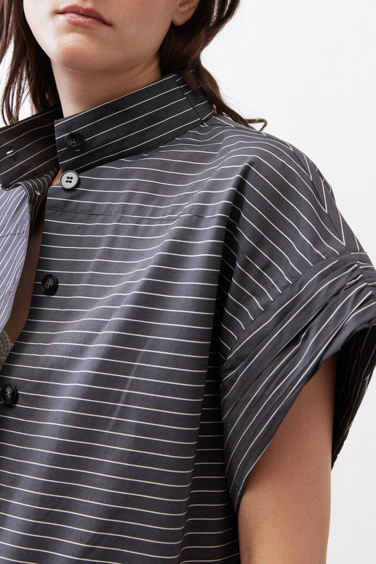 Gray striped blouse close-up with stand collar and button placket