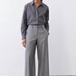 Gray-and-white striped button-down blouse with pointed collar and button front