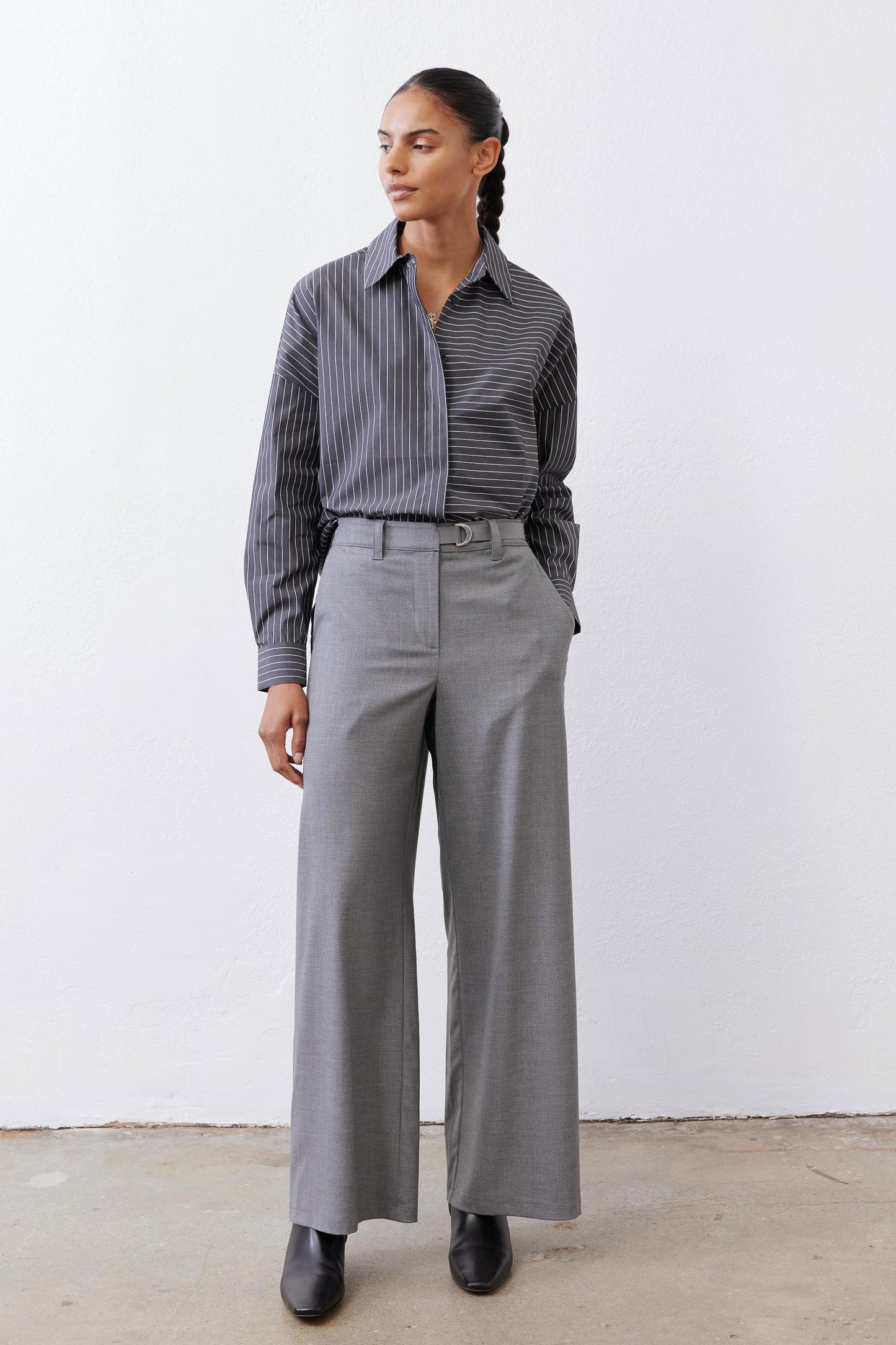 Gray-and-white striped button-down blouse with pointed collar and button front