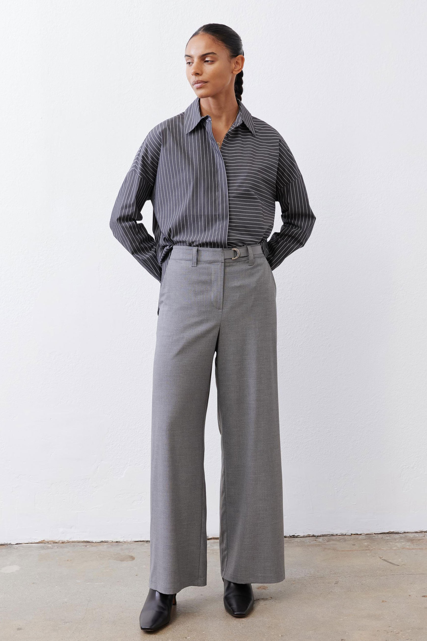 Gray-and-white striped button-down blouse, long sleeves, button front