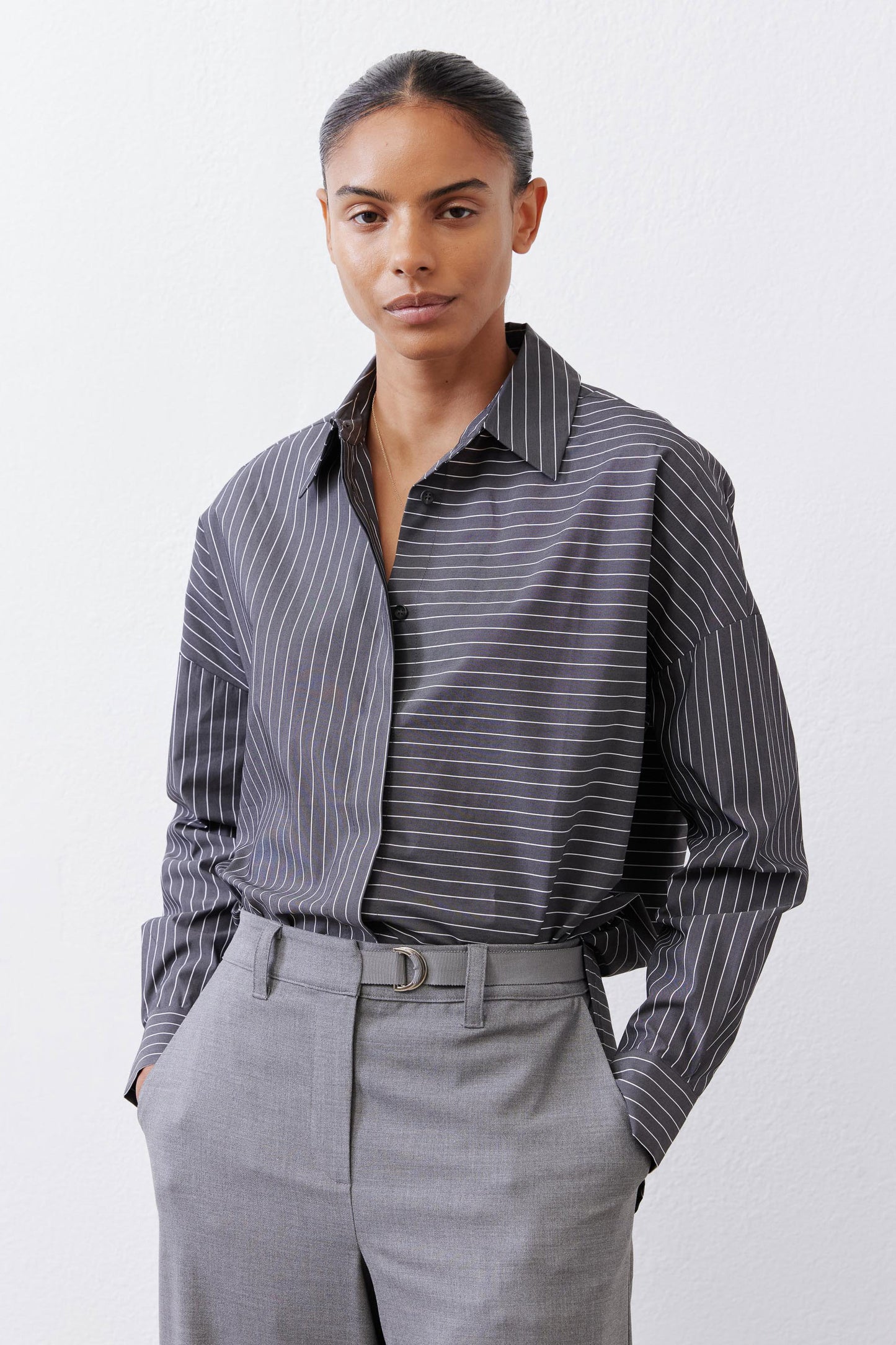 Striped button-down blouse with open collar and long sleeves