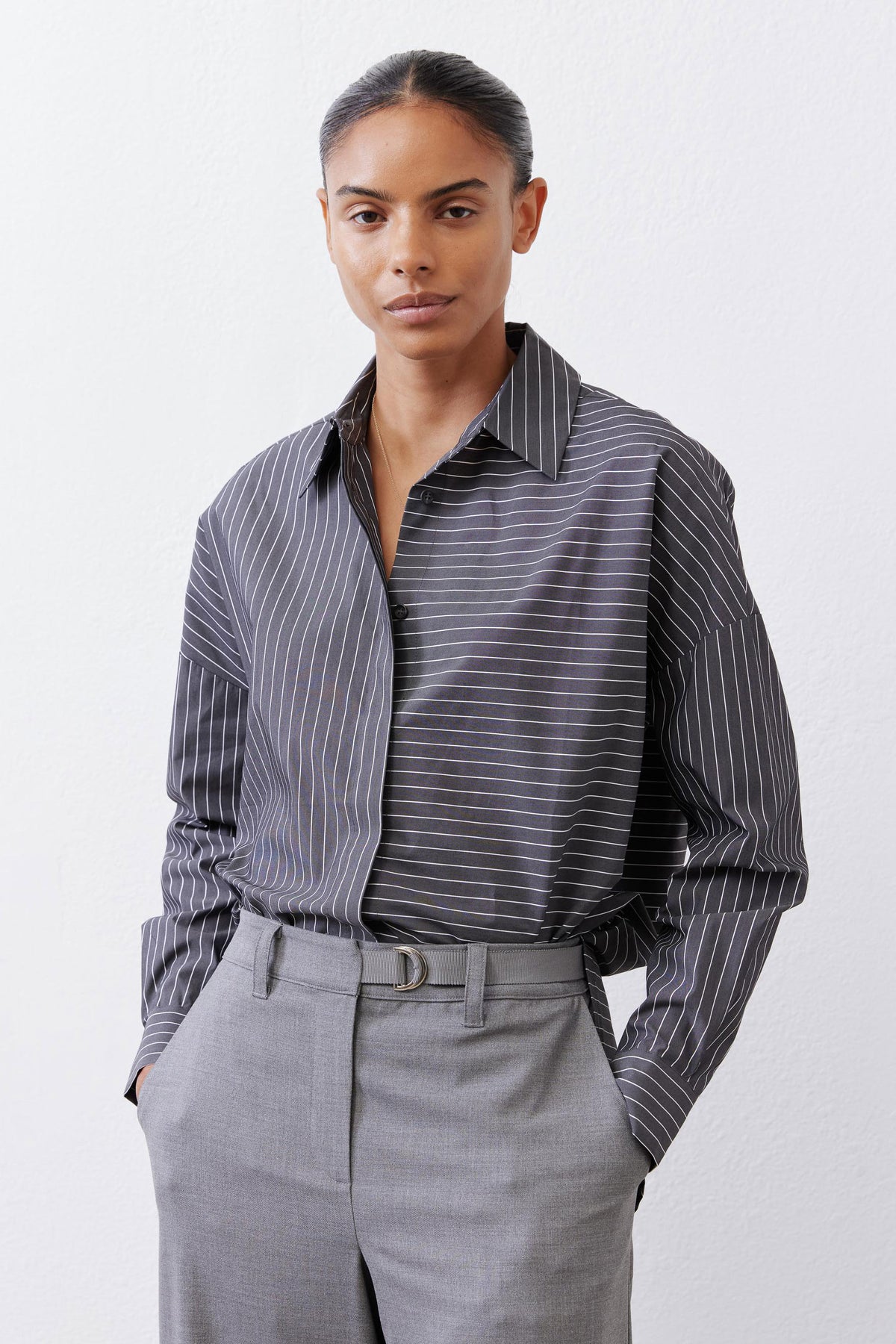 Striped button-down blouse with open collar and long sleeves