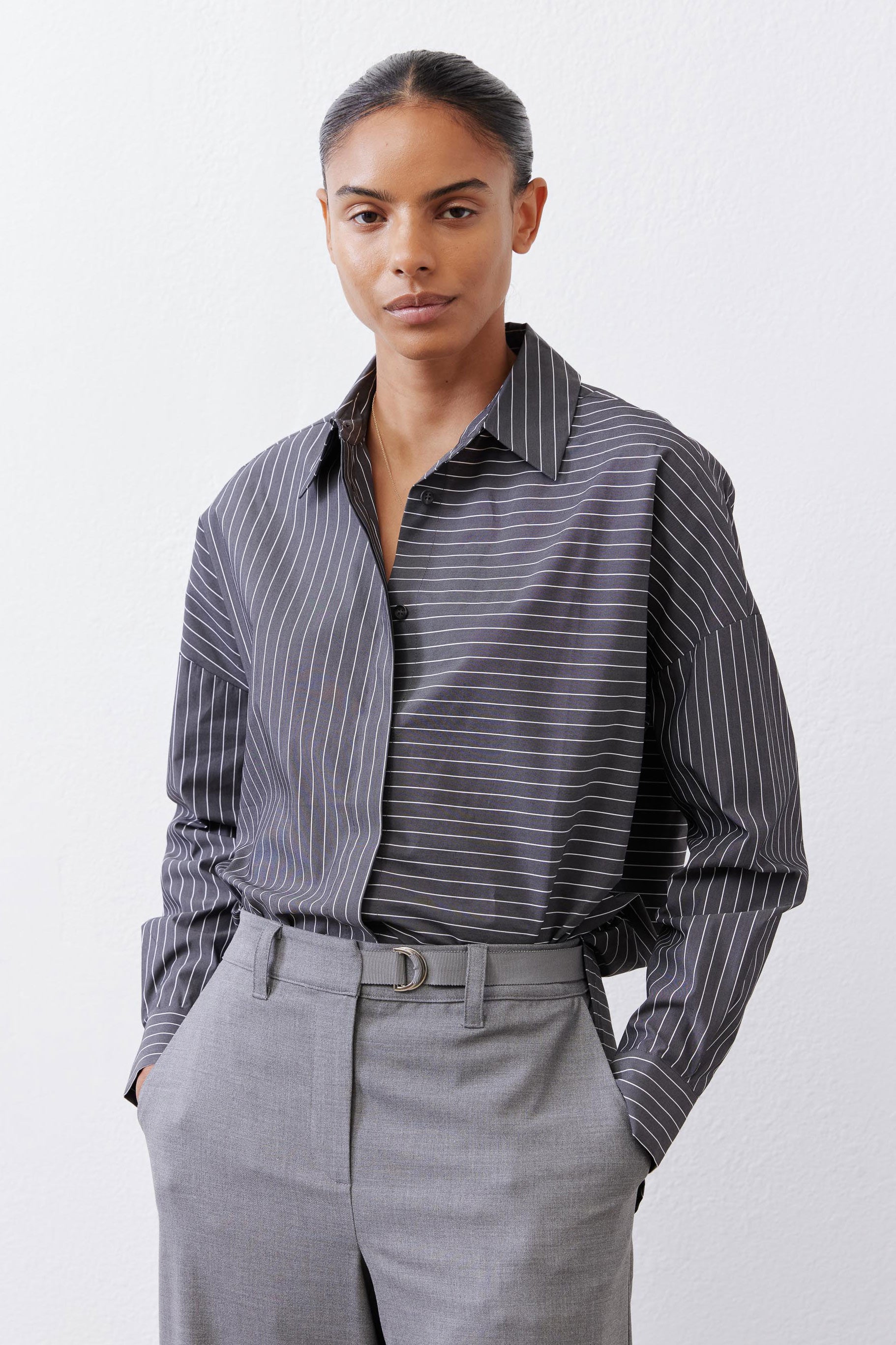 Striped button-down blouse with open collar and long sleeves