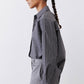 Gray-and-white striped button-down blouse, side view with long sleeves