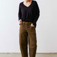 Black ribbed dolman long sleeve top with V-neck and loose, draped shoulders