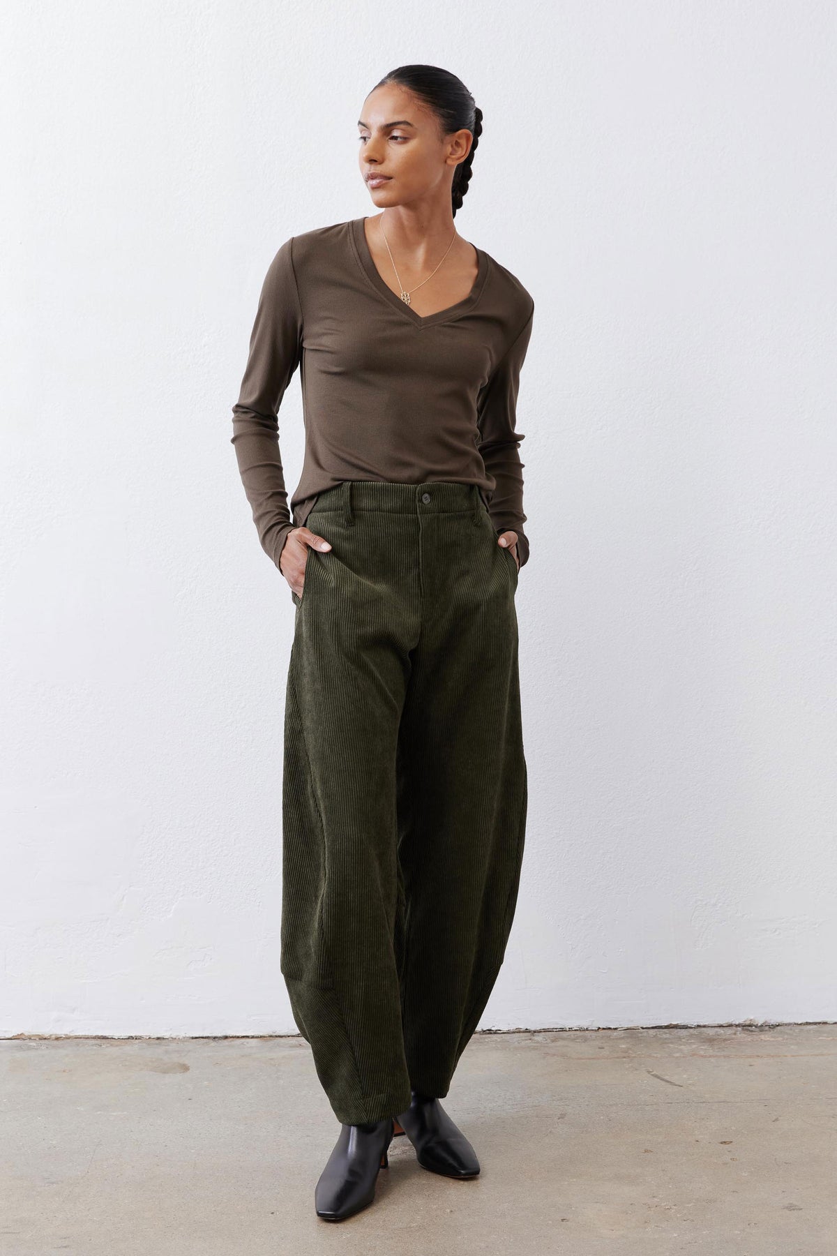 Olive-brown long-sleeve V-neck knit top, ribbed texture and slim fit