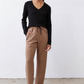 Black ribbed long-sleeve V-neck top, fitted with curved hem