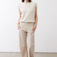 Light cream crewneck ribbed tee with short sleeves, worn with ankle pants