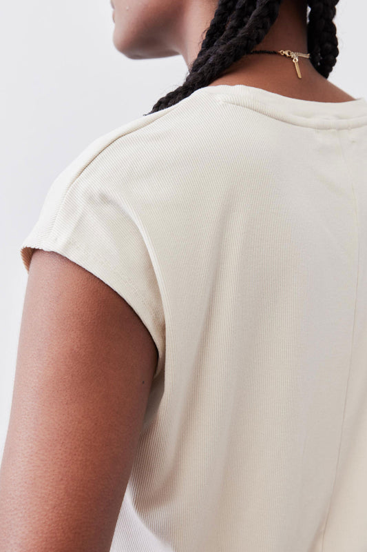 Light cream ribbed tee back close-up with short sleeves and crew neck