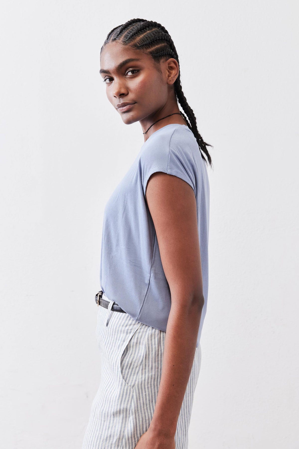 Light blue ribbed crew-neck tee with short sleeves, side profile