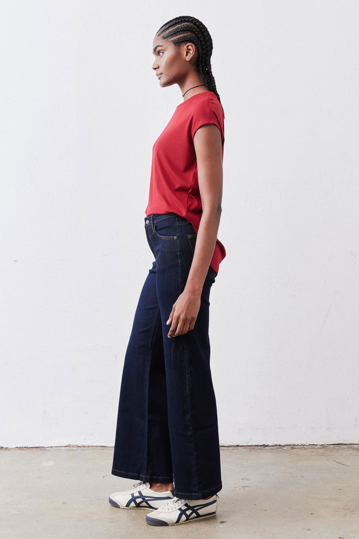 Garnet red short-sleeve tee with ribbed collar, side view