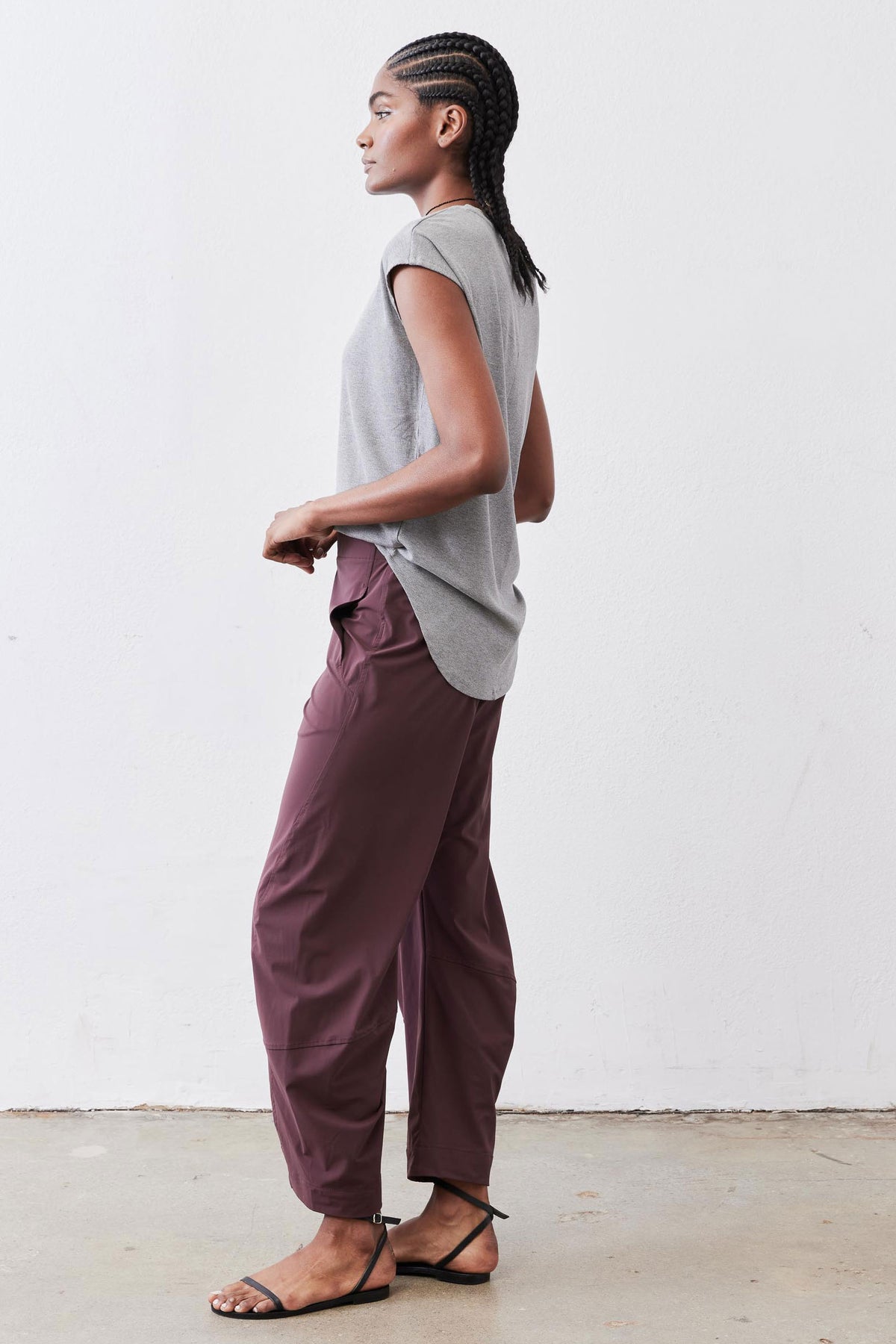 Gray melange ribbed crew-neck tee, sleeveless-looking short sleeves, side view