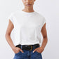 White ribbed crewneck tee with short sleeves, tucked into waistband