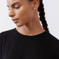 Black ribbed tuck-in tee crew neck, short sleeves, close-up on collar