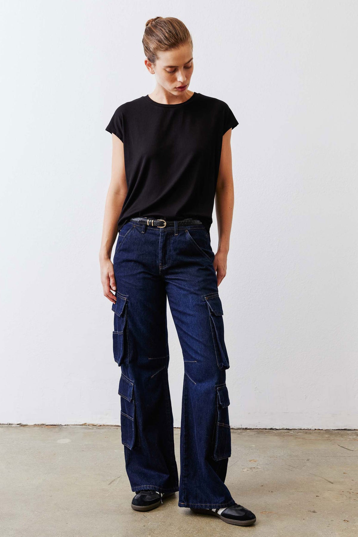 Black ribbed crewneck tee with short sleeves, relaxed drape