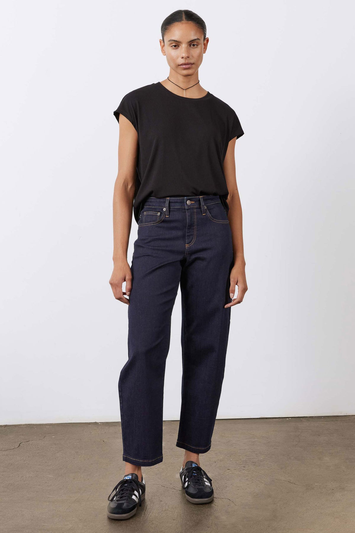 Black ribbed crewneck tee with short sleeves, relaxed fit