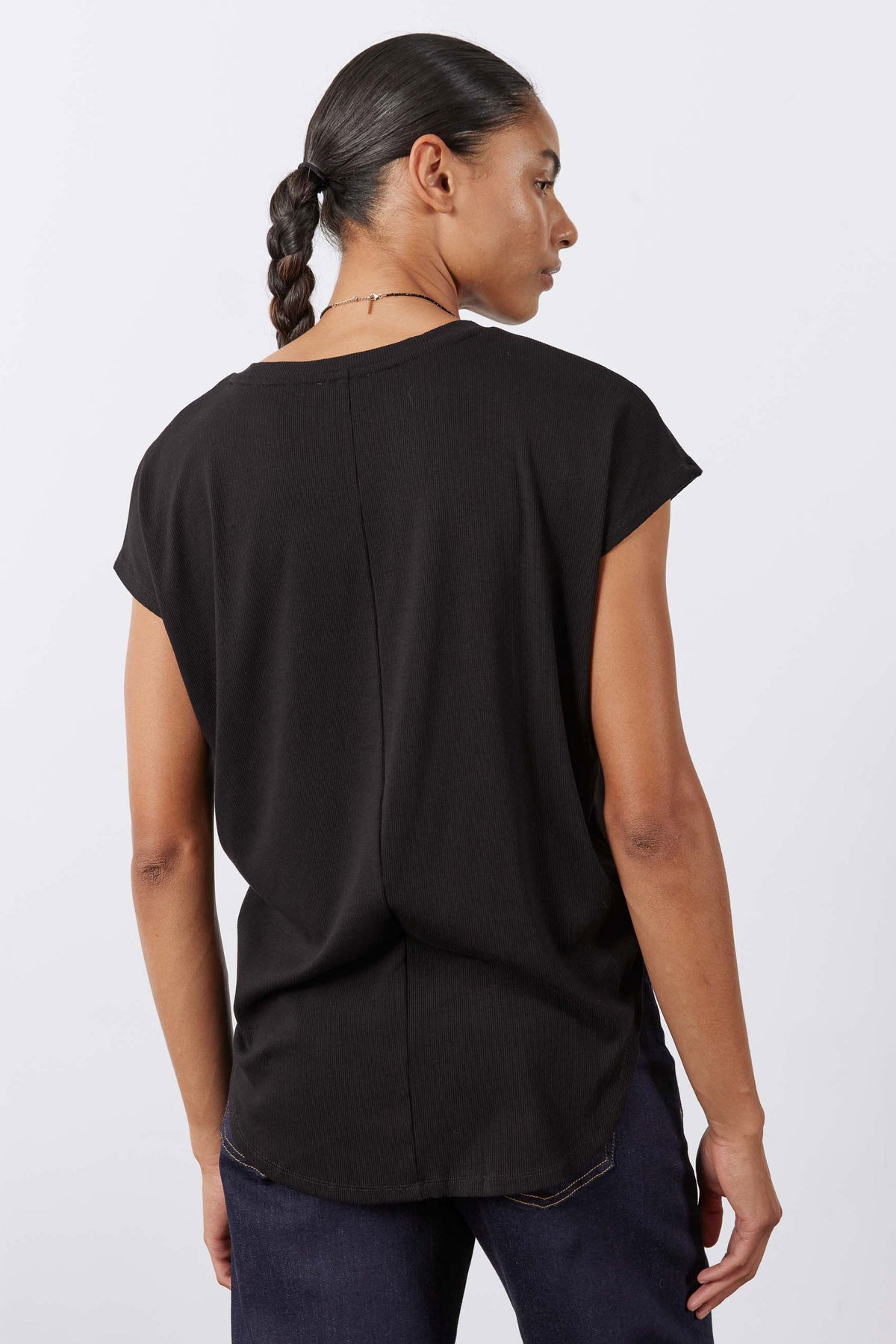 Black ribbed crewneck tee, short sleeves, center-back seam