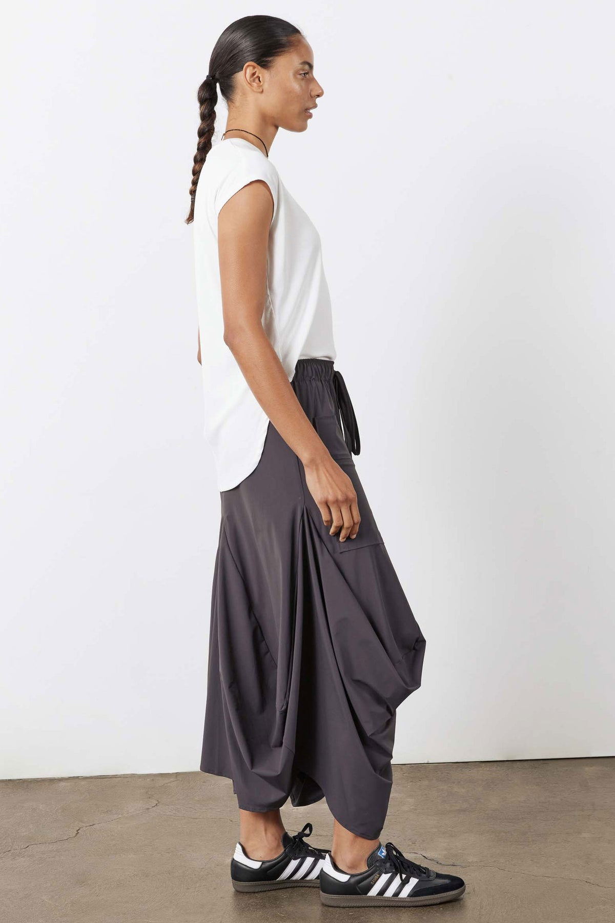 White ribbed tuck-in tee, side profile showing curved hem and crew neck
