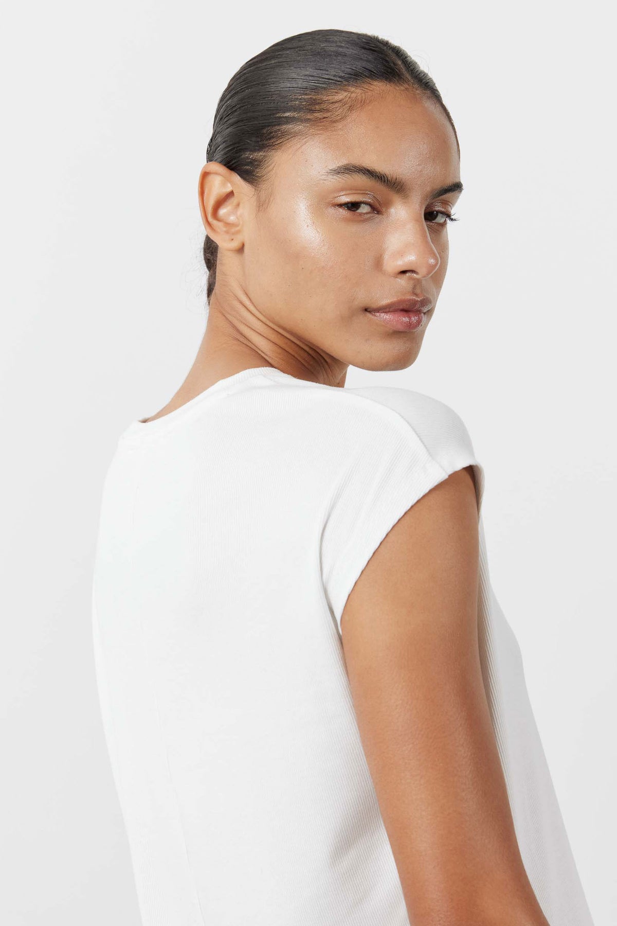 White ribbed tuck-in tee, back view with crew neck and short sleeves