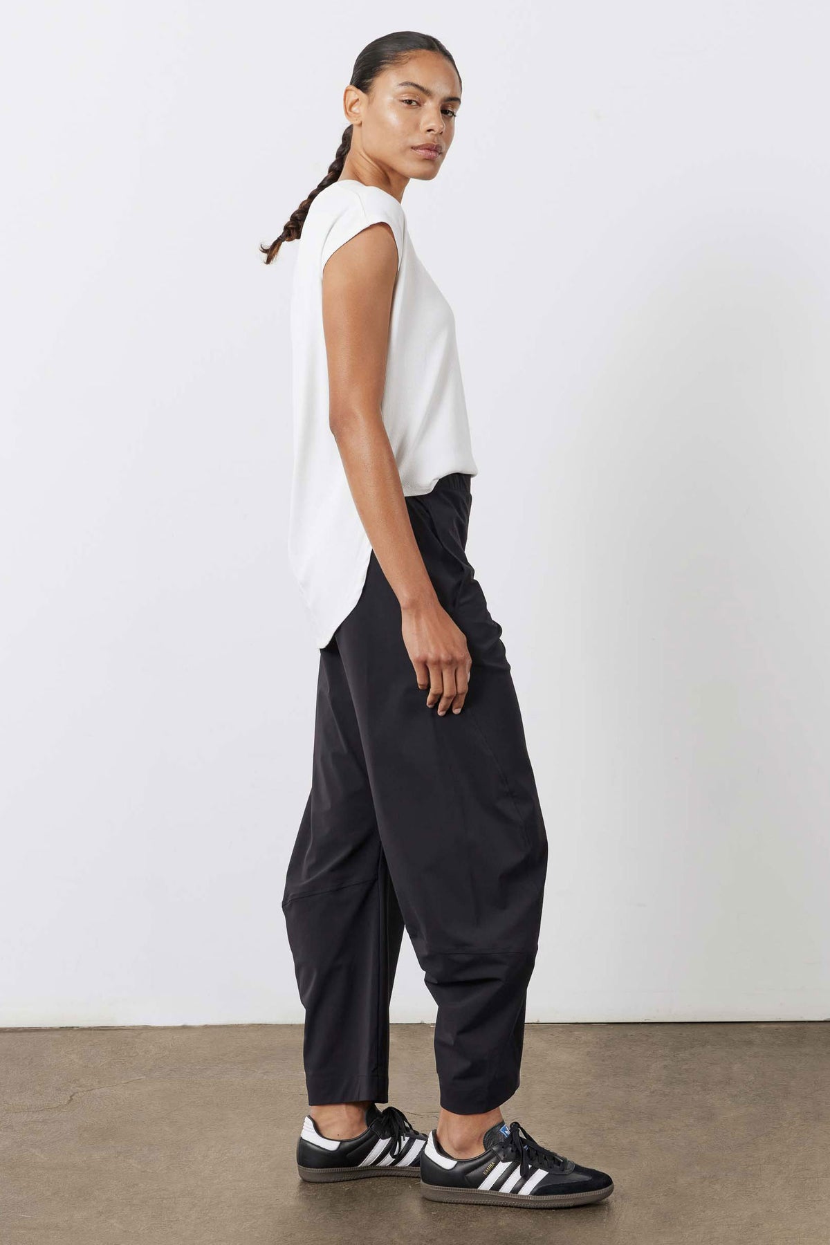 White ribbed tuck-in tee, angled view with side tuck and short sleeves