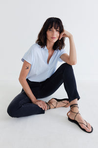 Washed black slim jeans with five-pocket styling and tapered legs