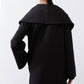 Black shawl-collar coat with back yoke seam and full-length sleeves
