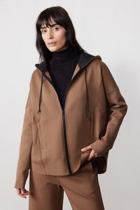 Front view of a mocha scuba zip hoodie with black zipper, drawstrings, and side pockets.