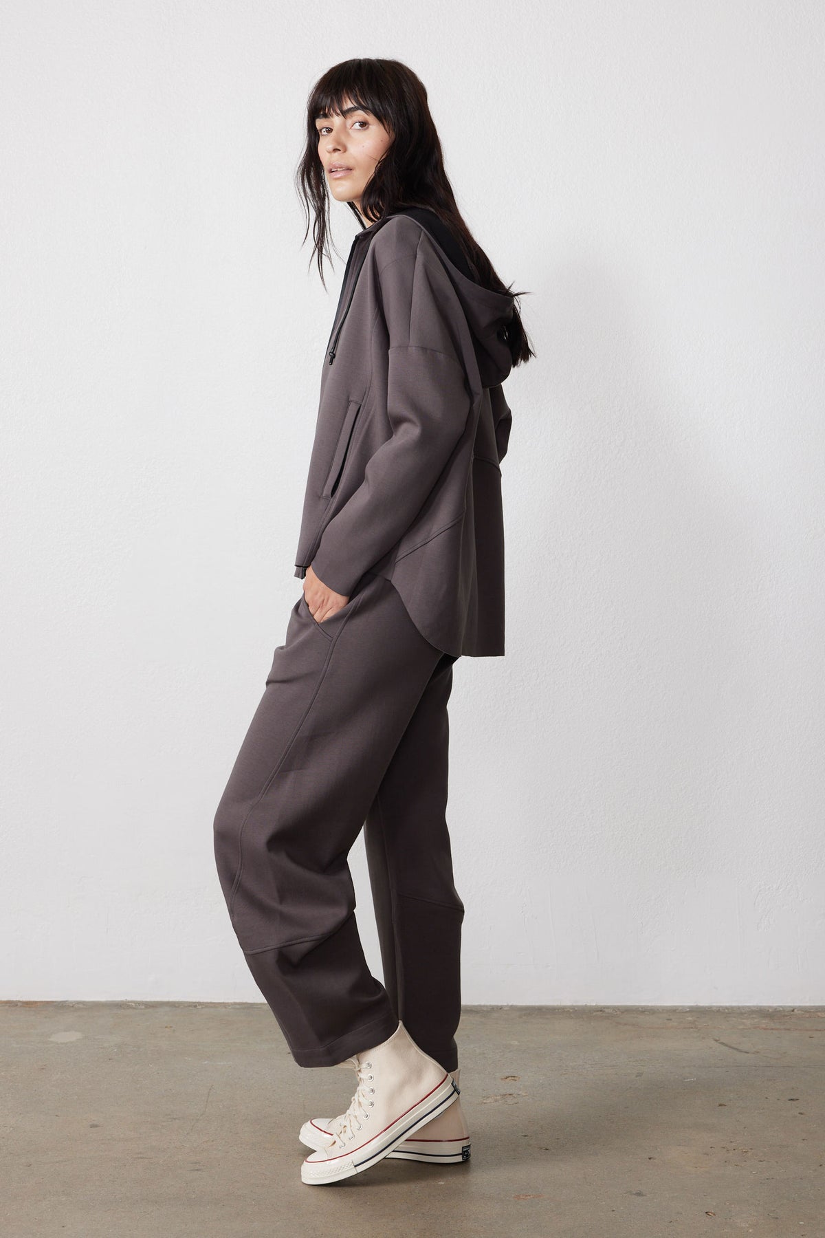 Storm gray scuba hoodie shown from the side, with a relaxed fit and hood.