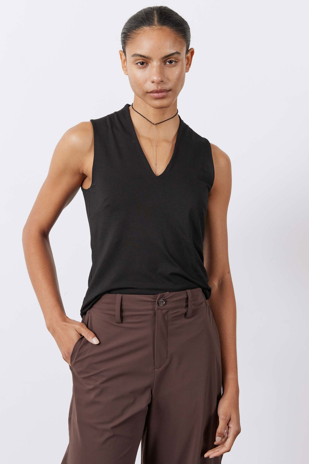 Black V-neck sleeveless tank top with sculpted fit