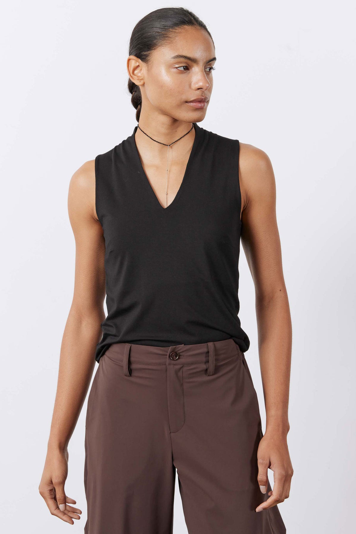 Black sculpted V-neck sleeveless tank, side view