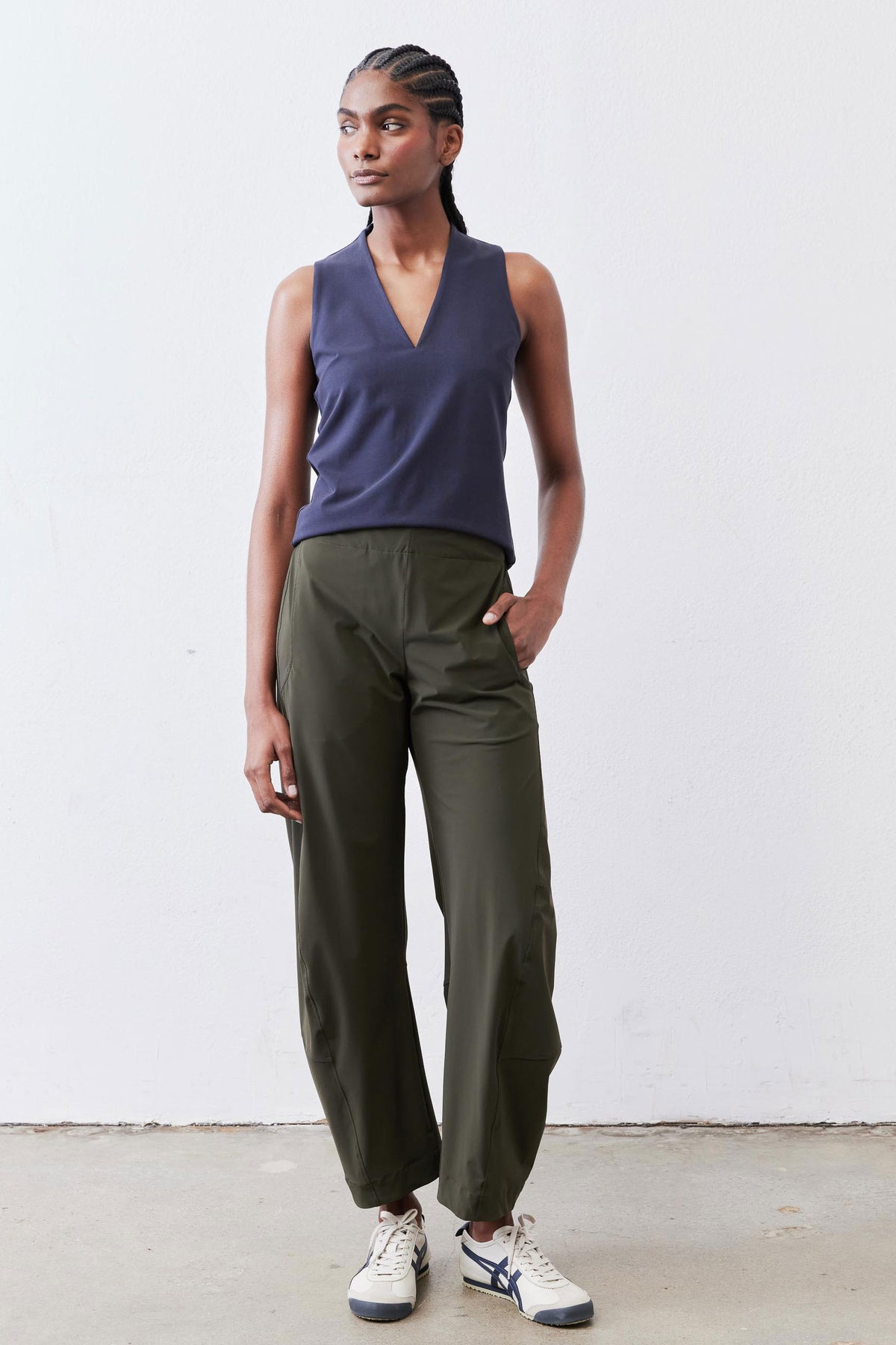 Sculpted tank top in deep sea blue with V-neck and fitted sleeveless silhouette