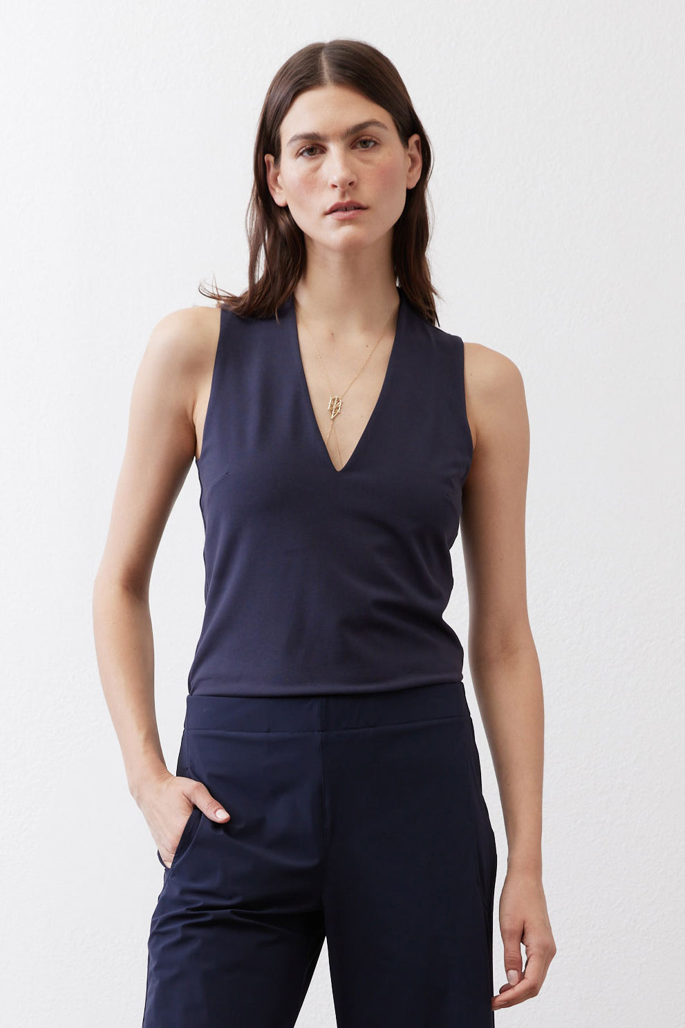 Sculpted tank top in deep sea blue with V-neck and fitted midsection seam