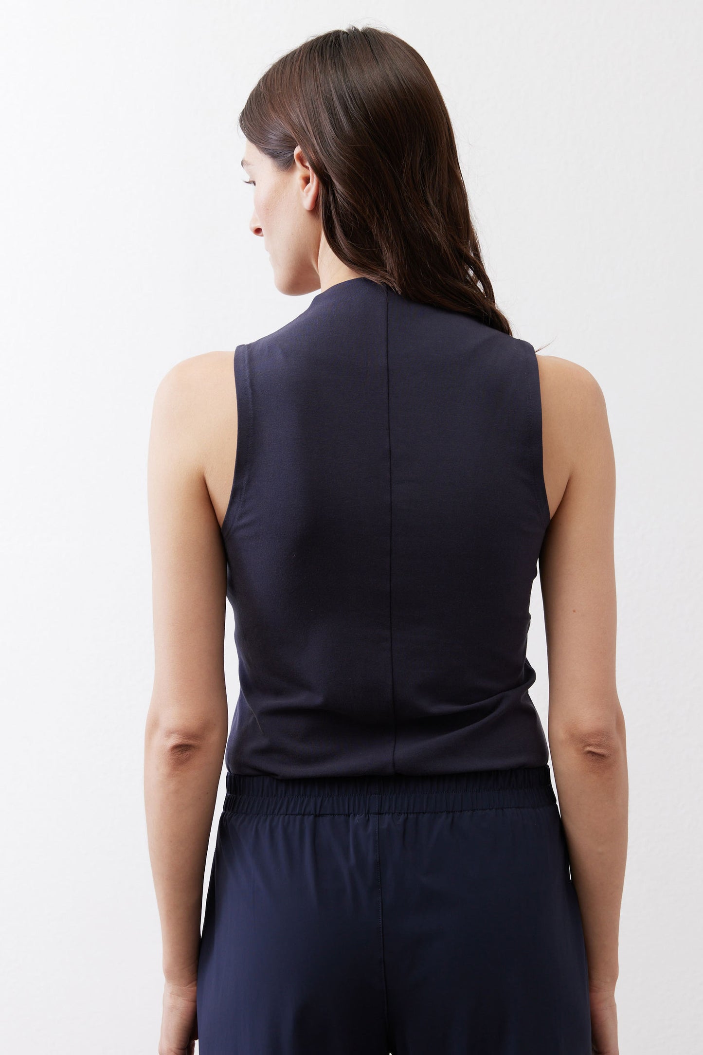 Sculpted tank top in deep sea blue, back view with fitted waist seam