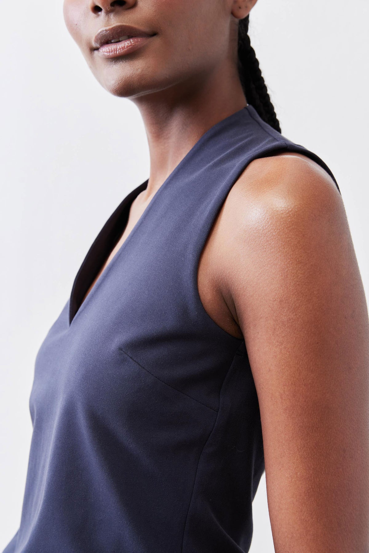 Sculpted tank top in deep sea blue with wide armholes and V-neck