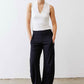 White sculpted V-neck tank top with black drawstring cargo pants