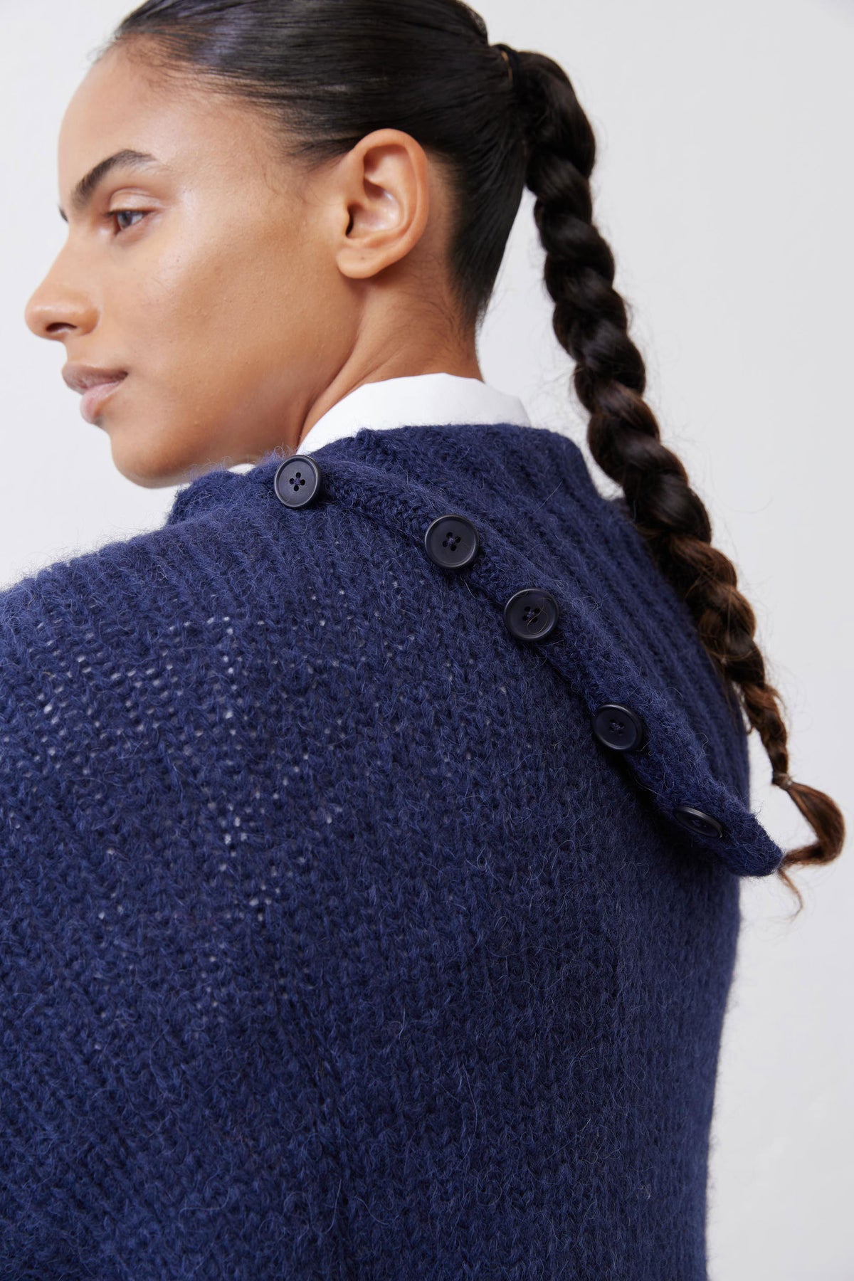 Midnight navy shawl-collar sweater with buttoned back neckline detail