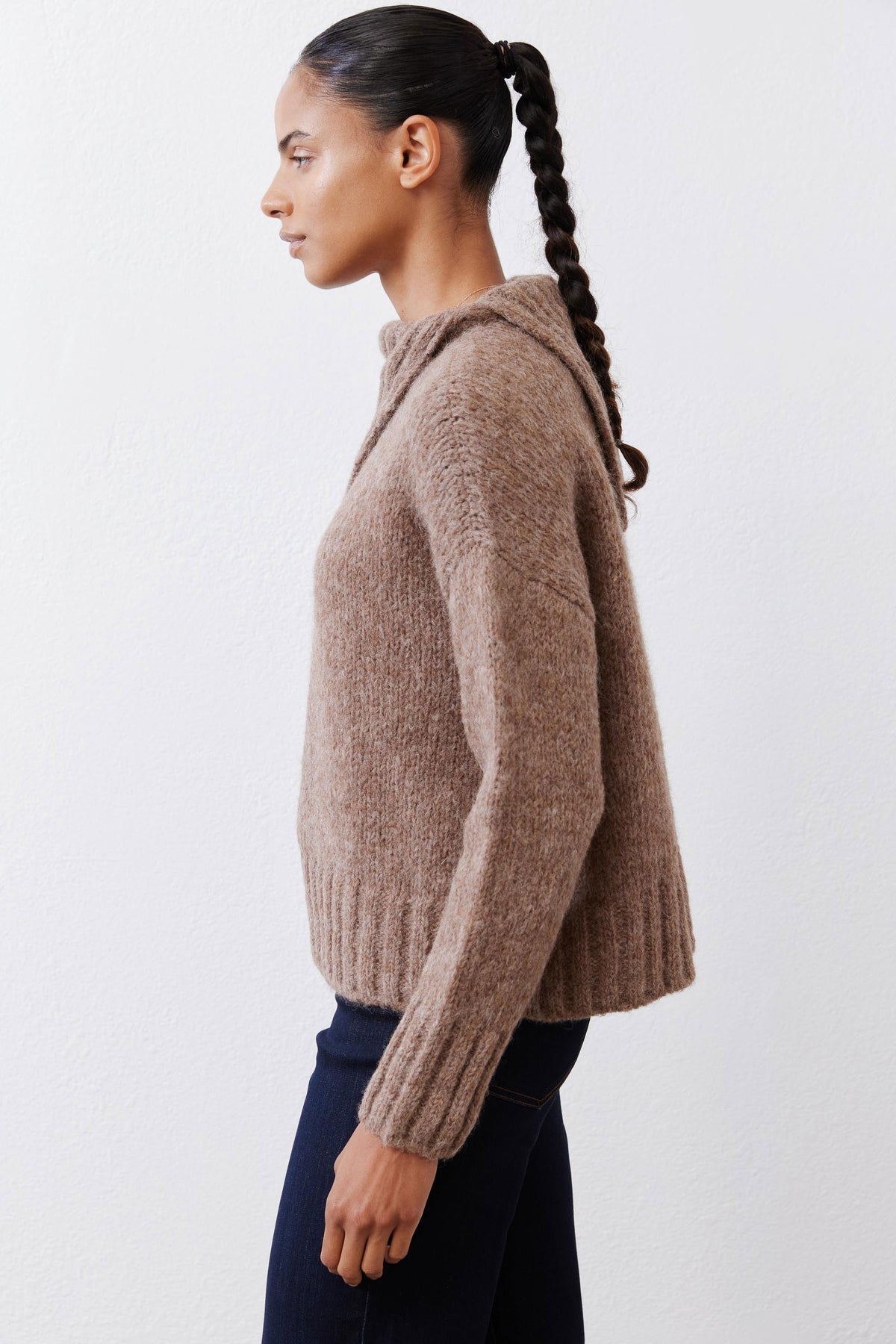 Taupe melange shawl-collar sweater, side profile with textured knit sleeves.