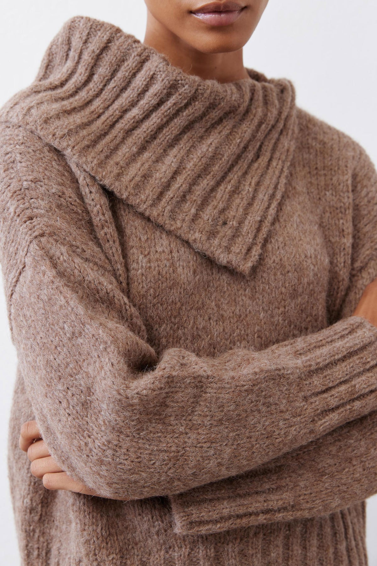 Taupe melange shawl-collar sweater close-up of collar knit and ribbed cuffs.