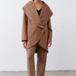 Fawn shawl-collar wrap coat with long sleeves, asymmetrical hem, and side pockets
