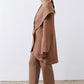 Fawn shawl-collar wrap coat with long sleeves and draped side panel