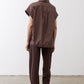 Chocolate short-sleeve button-down blouse back view with yoke seam